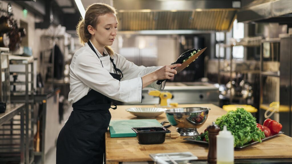 Home Side View Female Chef With Apron Cooking Kitchen 1024x576