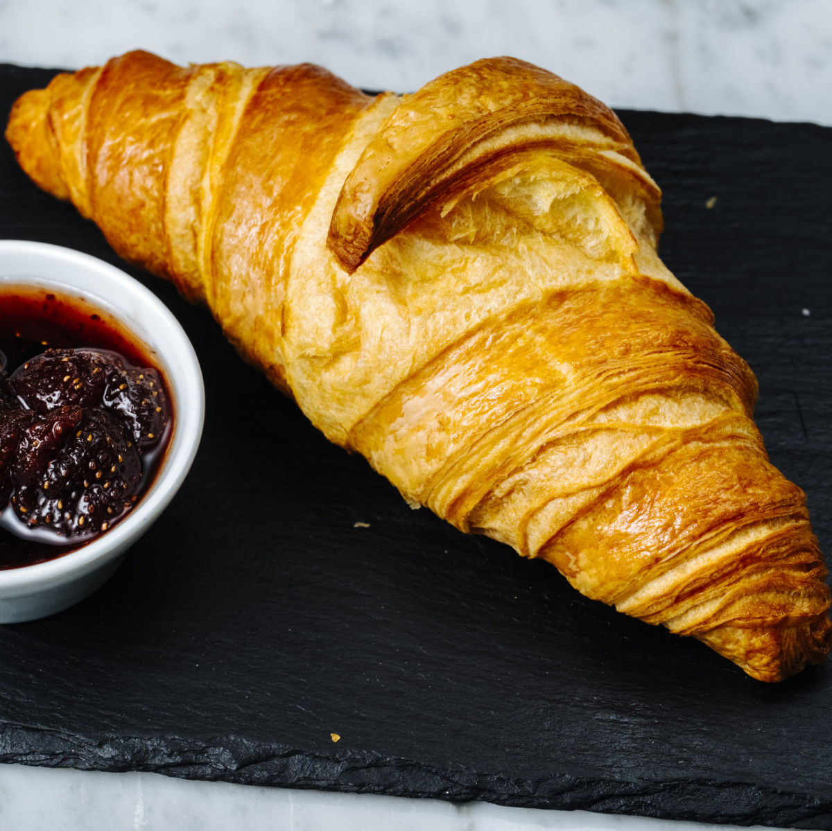 croissant with side strawberry jam